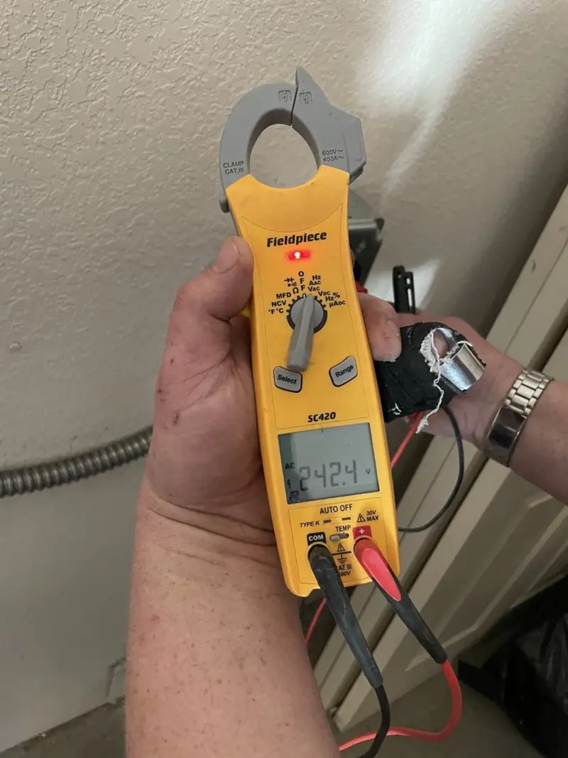 Voltage testing with clamp meter during Whole House Surge Protector in Grambling